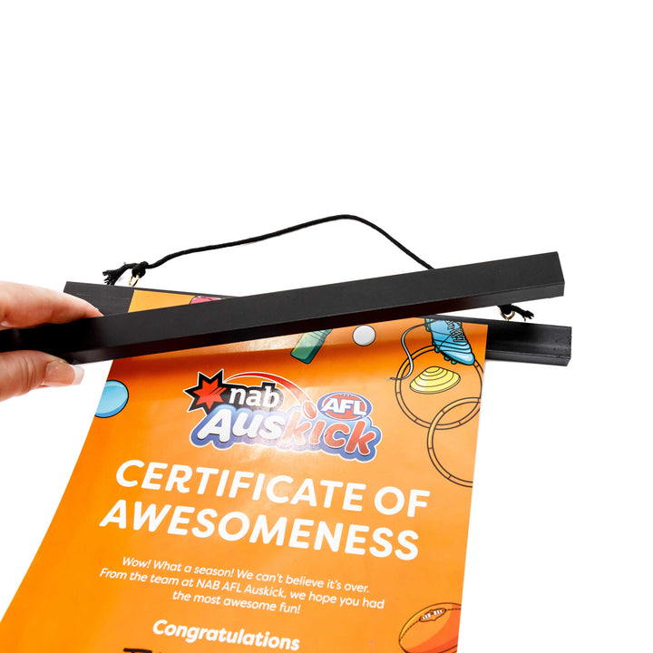 Magnetic black artwork display hanger – modern frame alternative for posters and certificates.