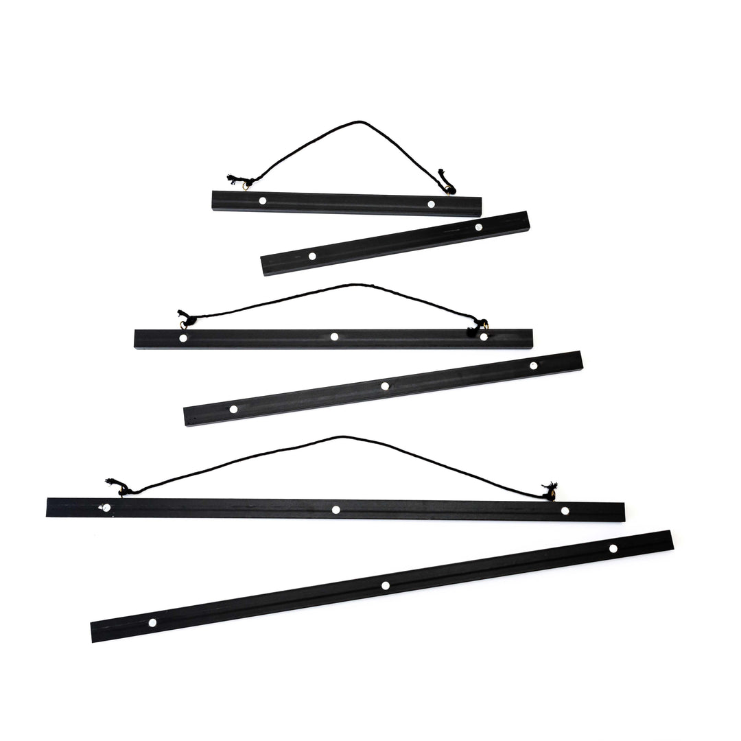 Magnetic black artwork display hanger – modern frame alternative for posters and certificates.