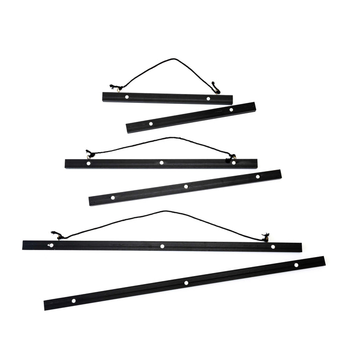 Magnetic black artwork display hanger – modern frame alternative for posters and certificates.